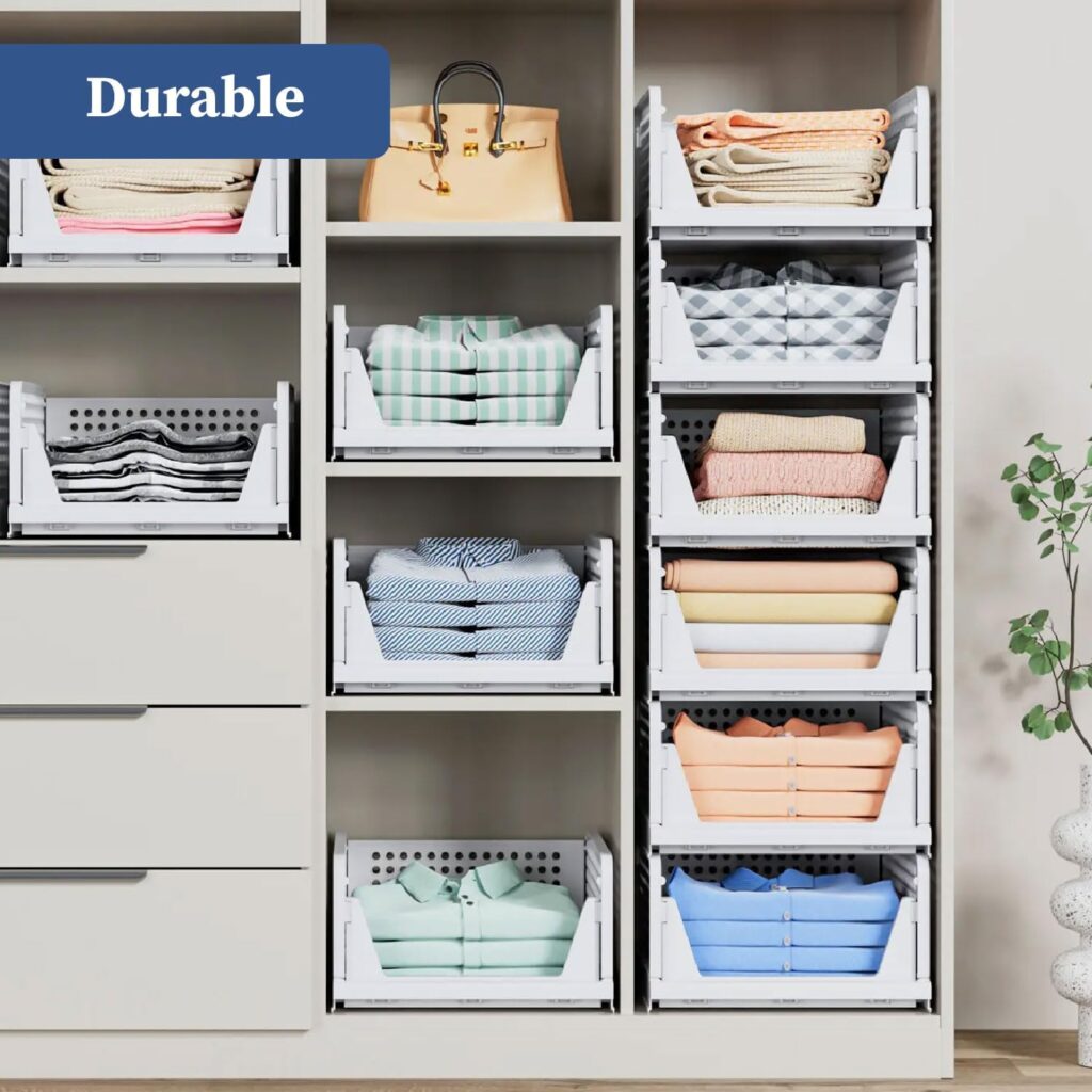Stackable plastic storage bins organized in a wardrobe with folded clothes and accessories, space-saving closet organizer solution