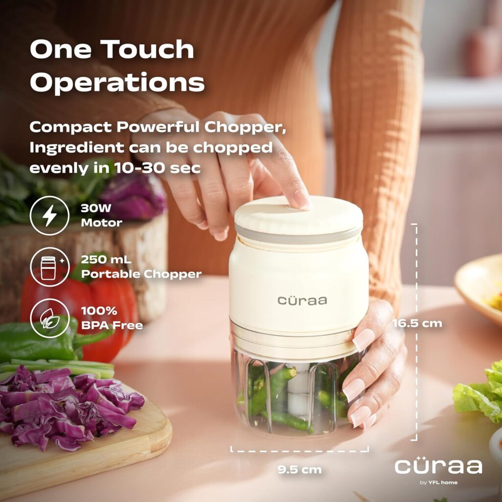 smart kitchen hacks tools Hand pressing a compact electric mini chopper chopping vegetables like chili and cabbage, 250ml portable food processor with one-touch operation